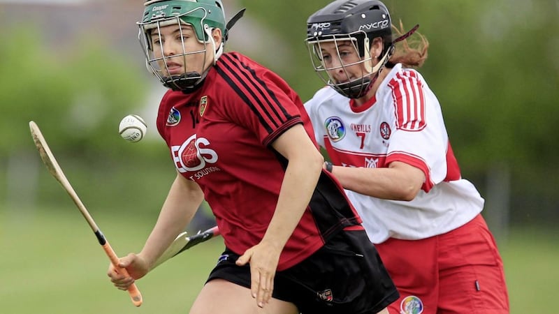Down&#39;s Niamh Mallon races away from Derry&#39;s Janet McGuckin during the Liberty Insurance All-Ireland Camogie Championship clash on June 16 2018. Picture: Philip Walsh. 