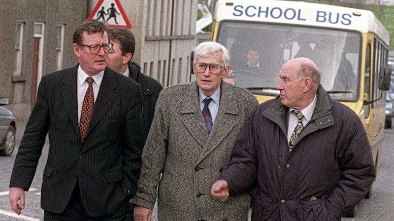 David Trimble and Seamus Mallon make their way through Poyntzpass with Tom Canavan in March 1998 