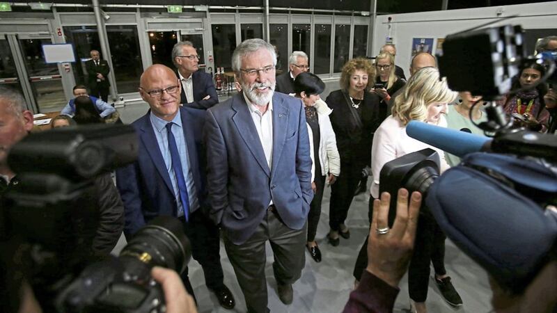 Gerry Adams arrives with Paul Maskey at the Titanic centre in Belfast for Thursday&#39;s count PICTURE: Niall Carson /PA 