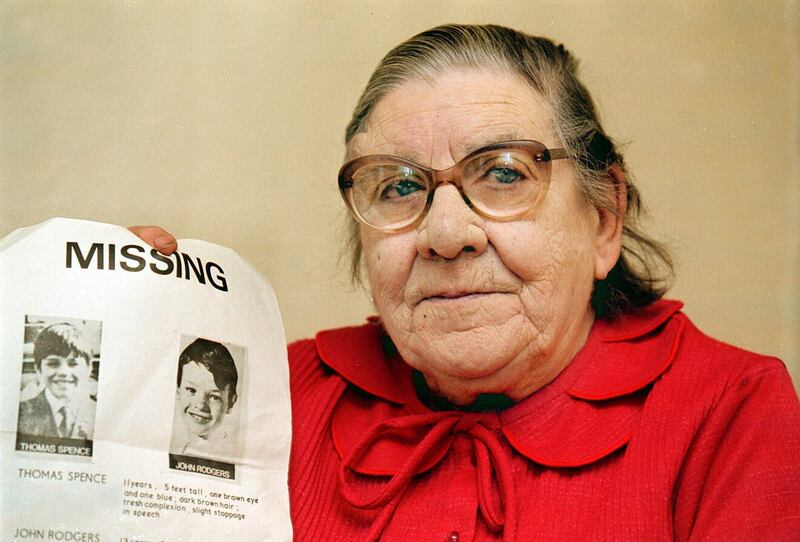 Alice Rodgers pictured in 2009 with the 'Missing' poster for her son, John, and his friend Thomas Spence, who disappeared in 1974. Picture by Bill Smyth