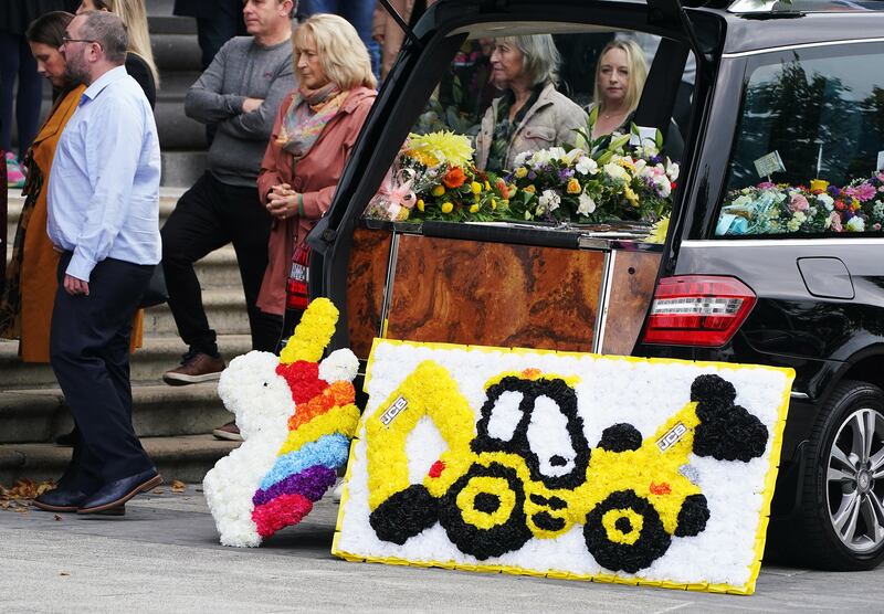 Floral tributes are left at by the hearse as the funeral mass for Mikey (2) and Thelma Dennany (5) takes place at St Mel’s Cathedral, Longford. The brother and sister died in a car fire in Co Westmeath last week. Picture date: Thursday September 15, 2022.