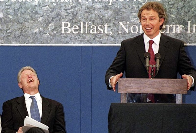 President Bill Clinton laughs during a speech by Prime Minister Tony Blair at the site of the planned Springvale campus in west Belfast in September 1998. Picture by Martin Wright/Pacemaker Press. 