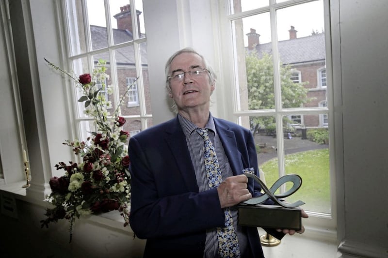 Dr Dr Eamon Phoenix at Clifton House, the oldest public building still in use in Belfast, with his CRC Good Relations Award. Picture By Hugh Russell 