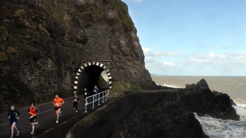 Competitors take part in the Premier Power Larne Half Marathon as they run past the Black Arch tunnel along the Antrim coast road. Picture by Bill Smyth&nbsp;