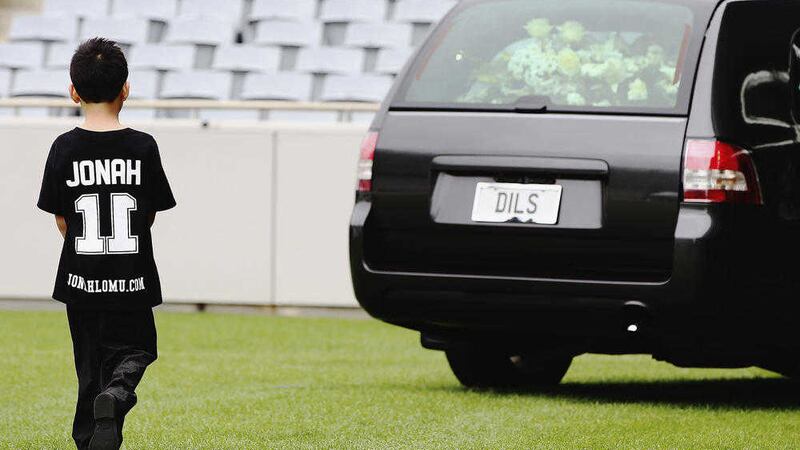 Dhyreille Lomu, son of Jonah Lomu, follows the hearse Picture: Hannah Peters 