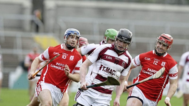 Slaughtneil&#39;s Brendan Rodgers is pursued by Cuala pair David and Sean Treacy during Saturday&#39;s semi-final Picture: Philip Walsh 