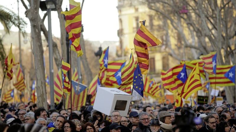 People hold &#39;estelada&#39; pro-independence flags after former president of the Catalan regional government Artur Mas arrives at Catalonia&#39;s high court in Barcelona Picture by Manu Fernandez/AP 
