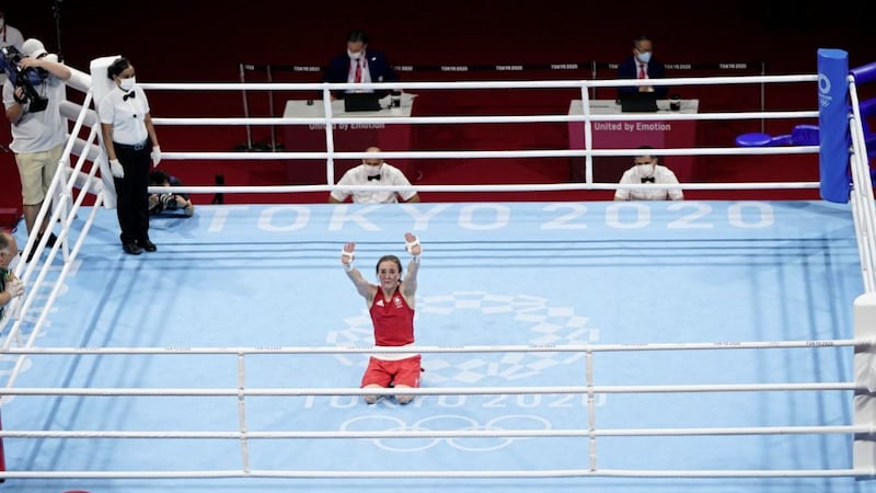 Kellie Harrington falls to her knees as she celebrates in the middle of the ring after defeating Brazil&#39;s Beatriz Ferreira in the lightweight final at last summer&#39;s Tokyo Olympics. Picture by AP 