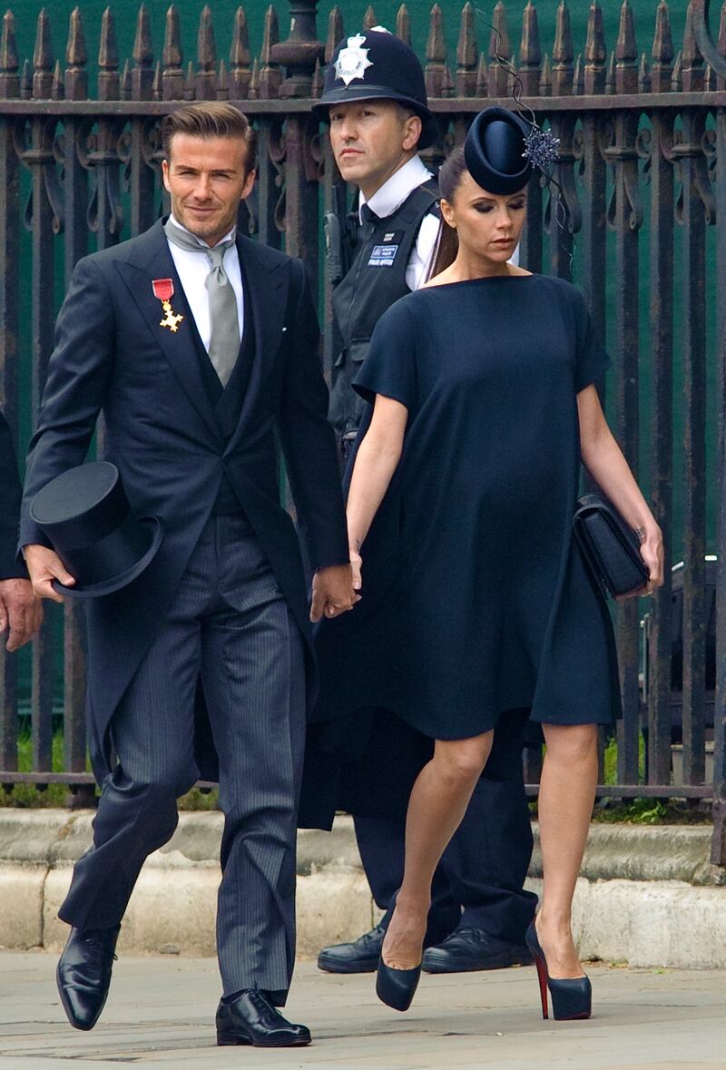 David Beckham and his wife Victoria Beckham arrive at Westminster Abbey for the wedding of Prince William and Kate Middleton