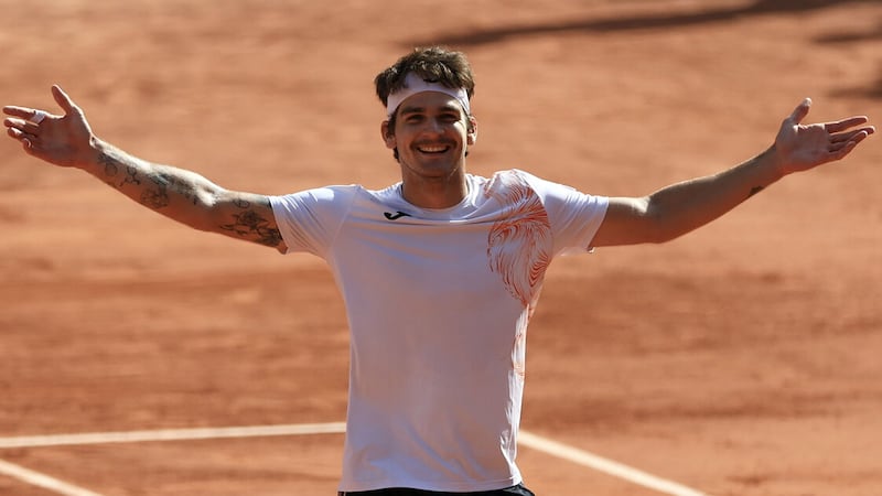 Thiago Seyboth Wild celebrates after knockng out second seed Daniil Medvedev in the first round of the French Open on Tuesday 