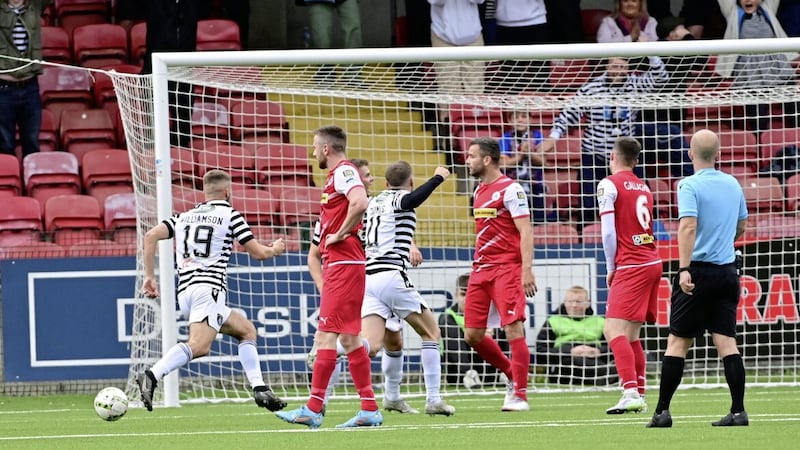Dom Thomas scores the winner for Queen&#39;s Park at Solitude yesterday Picture by Colm Lenaghan/Pacemaker 