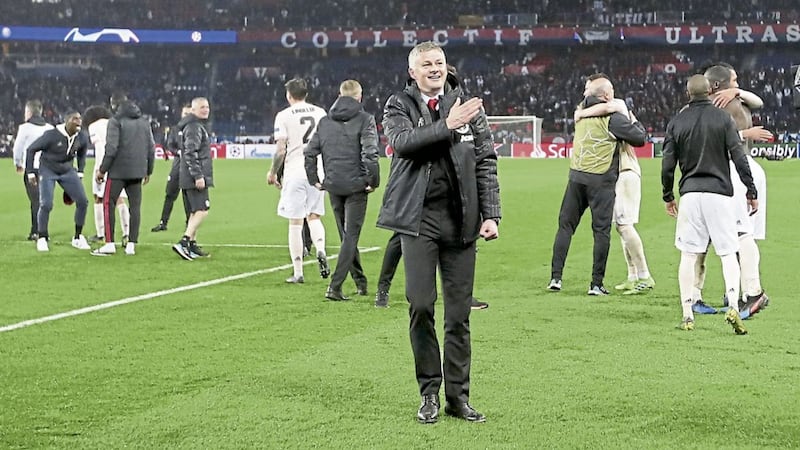 Manchester United caretaker manager Ole Gunnar Solskjaer milks the adulation from the travelling fans after his side&#39;s win over PSG 