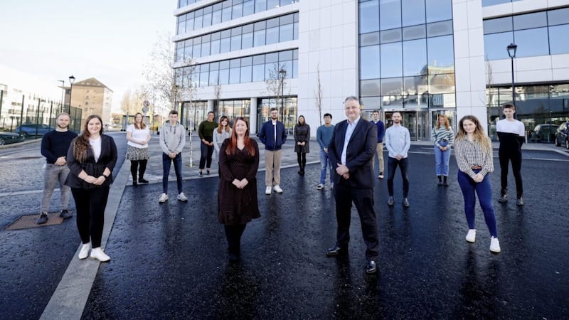 Allstate NI&#39;s talent and acquisition consultant Shannon Ellis and vice president and managing director John Healy pictured with some of the recent recruits to graduate roles within the company. Picture: Philip Magowan/PressEye 