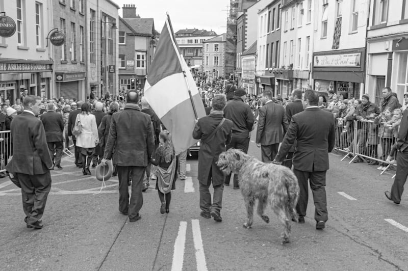 Former Sinn F&eacute;in councillor, Eamonn Mac Con Midhe with his Irish wolfhound, leading a St Patrick&rsquo;s Day procession in Downpatrick, Co Down, in 2011. Picture from Bobbie Hanvey Photographic Archives, John J. Burns Library, Boston College, Courtesy of the Trustees of Boston College 