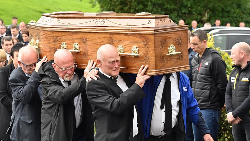 The coffin of Gene McDonald is carried into St Mary’s Church, Middle Chapel, Co Caven (Oliver McVeigh/PA)