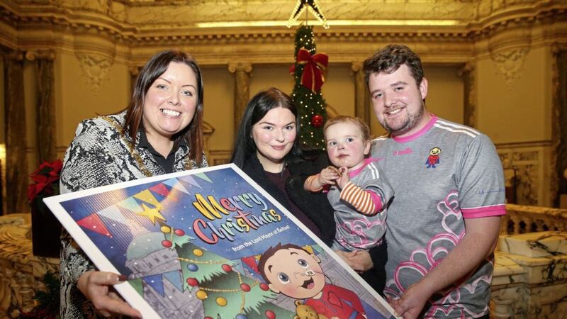 Lord Mayor, Deirdre Hargey unveils her official Christmas card featuring D&aacute;ith&iacute; Mac Gabhan (2) born with hypoplastic left heart syndrome and is awaiting a heart transplant, the toddler&#39;s parents M&aacute;irtin and Seph were also there to help launch the card. Picture Mal McCann 