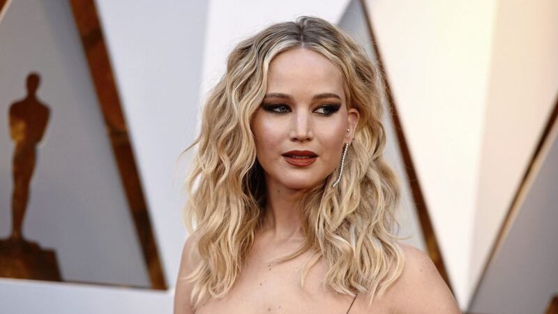 Jennifer Lawrence arriving at the Oscars 2018 with the look of a woman hoping against hope that she&#39;ll be asked to compile a wedding gift registry 