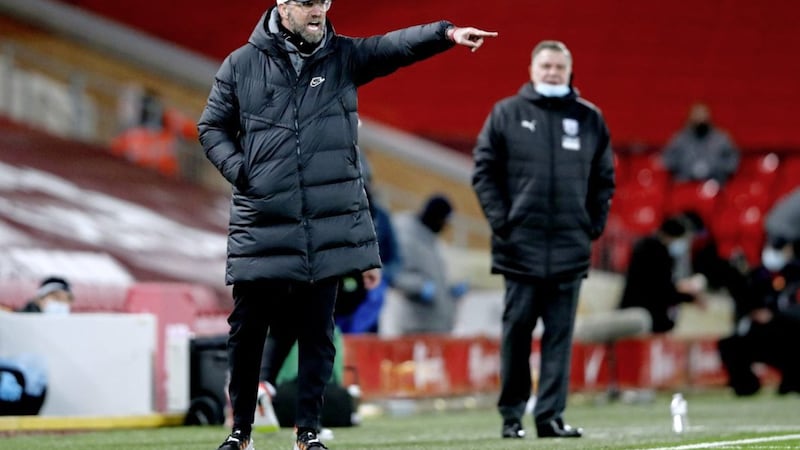 New West Brom boss Sam Allardyce looks on as Liverpool manager Jurgen Klopp gestures on the touchline at Anfield. 