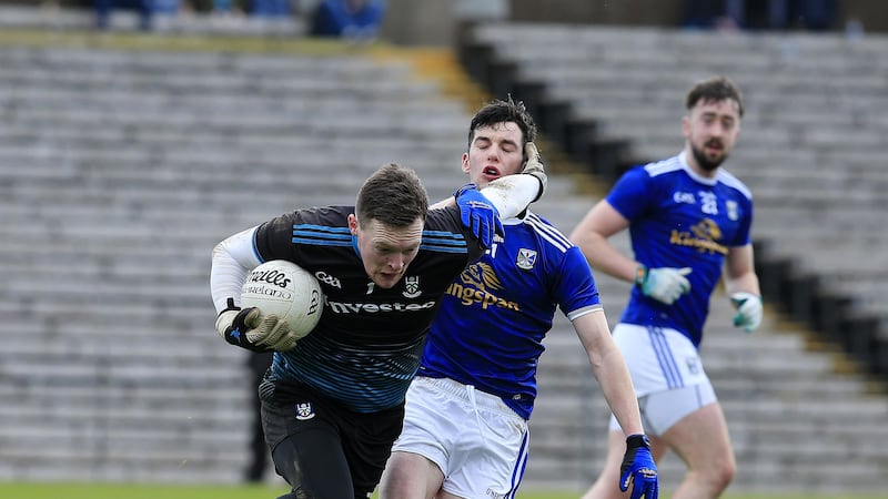 Rory Beggan holds off Cavan Pierce Smith during Saturday's Division One clash in Clones. Picture by Philip Walsh