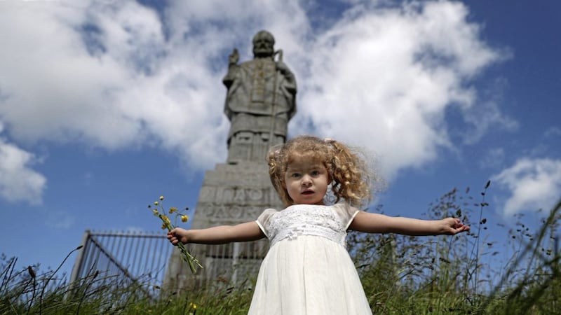 Three-year-old Isabela Marie Smith enjoying the summer weather on top of St Patrick&#39;s mountain at Saul in Co Down, on which stands the world&#39;s largest statue of St Patrick. More than 300 people took part in the annual Down and Connor Diocesan Pilgrimage on Sunday, led by Bishop Noel Treanor. Picture by Bill Smyth. 