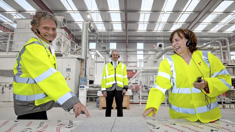 L-R: Tobermore managing director David Henderson takes Economy Minister Diane Dodds and Invest NI boss Kevin Holland (centre) on a tour of his factory. Picture By Justin Kernoghan. 