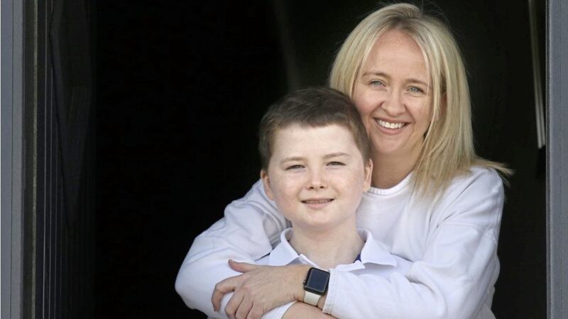 Reece Magill with his mum Jolene at their family home in Glengormley. Picture by Hugh Russell 