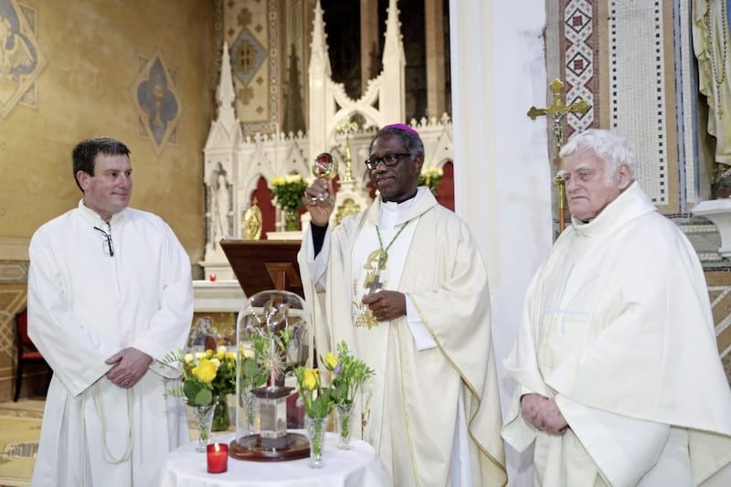 Saul parish priest Fr Paul Alexander, Deacon Jackie Breen and Papal Nuncio Archbishop Jude Thaddeus Okolo bless the congregation with the relic of St Patrick at the novena Mass held in St Patrick&#39;s Church, Saul. Picture by Bill Smyth. 