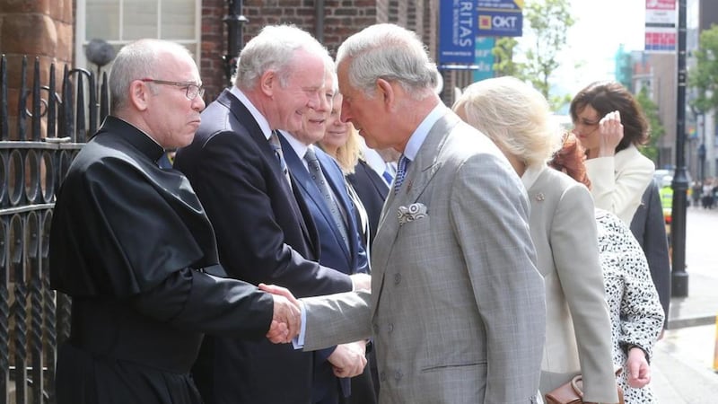 Fr Michael Sheehan, pictured shaking the hand of Prince Charles at St Patrick's Church, is moving on to become the Parish Priest at Drumbo and Carryduff. Picture: Hugh Russell