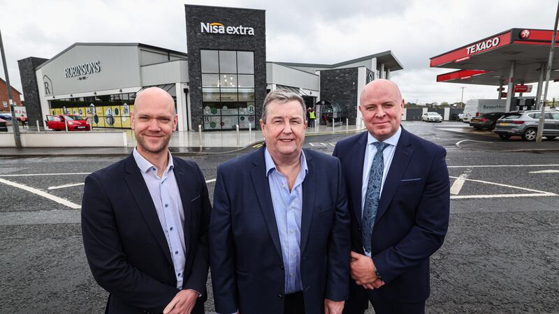 L-R: Robinson’s Nisa Extra owner Finlay Robinson (centre), with Peter Houston and Mark Brown from Danske Bank