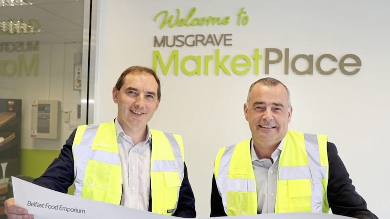 Michael McCormack, managing director of Musgrave NI and Trevor Magill, wholesale director of Musgrave NI looking over plans for the &pound;1.1 million renovation at Musgrave MarketPlace Duncrue 