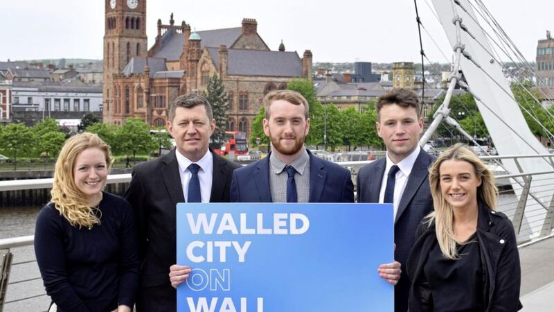 Pictured at the Peace Bridge in Derry are FinTrU executive director &amp; north west office site head Greg McCann (second left) with previous Assured Skills Academy graduates and now FinTrU analysts Jenny Thompson, Damian Faulkner, CJ Martin and Megan Quigley  