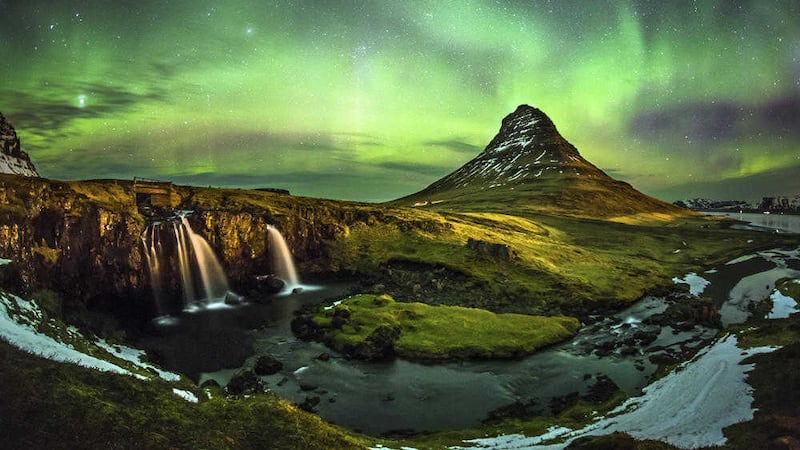 The aurora borealis over Mount Kirkjufell in Iceland 
