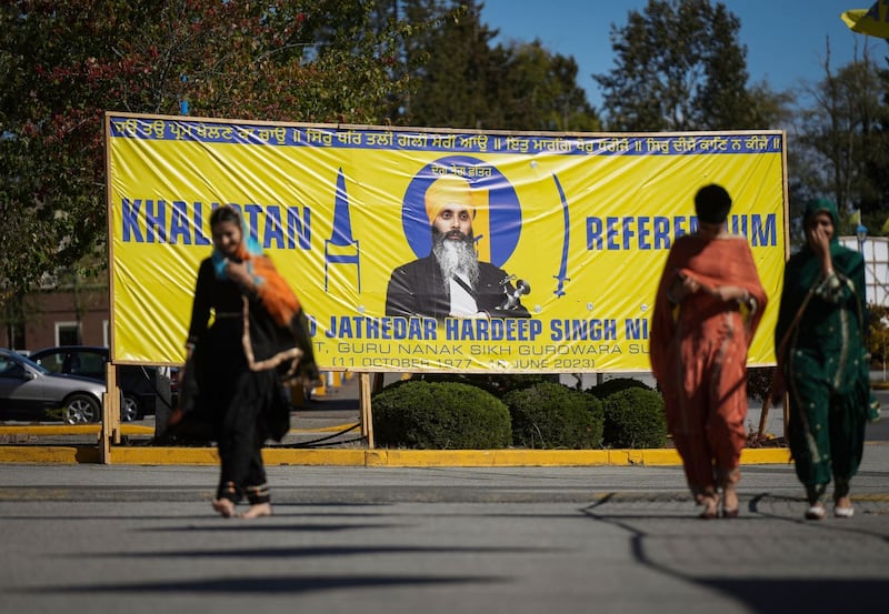 A photograph of Hardeep Singh Nijjar is seen on a banner outside the Guru Nanak Sikh Gurdwara Sahib in Surrey, British Columbia