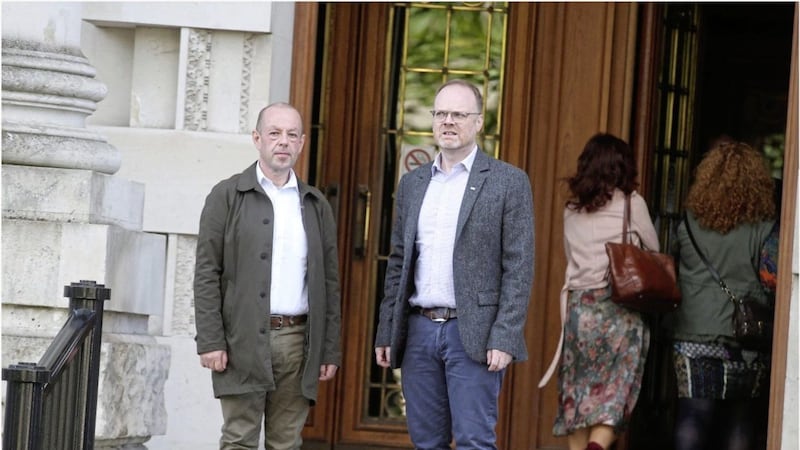 Investigative journalists Barry McCaffrey (left) and Trevor Birney, who worked on the film No Stone Unturned, on the way into the High Court in Belfast earlier this month following their recent arrest for the alleged theft of material from PONI. Photo: Hugh Russell 