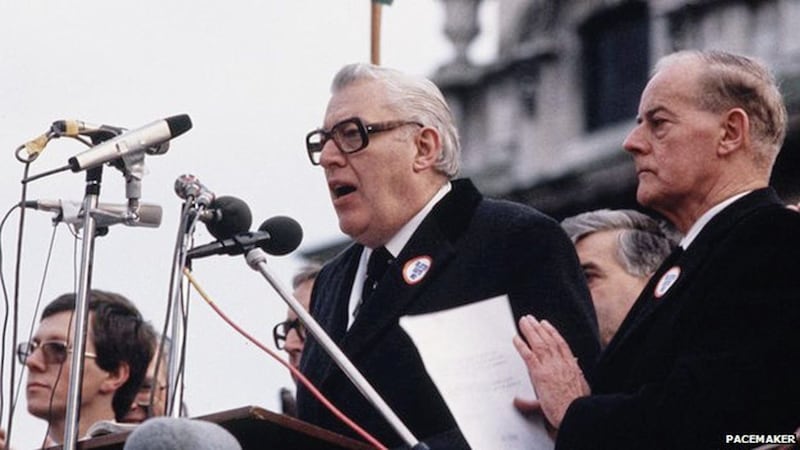 DUP leader Ian Paisley, flanked by Peter Robinson and James Molyneaux, speaking at a rally against the Anglo Irish Agreement in November 1985. 