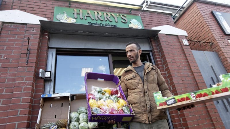 Younes Belal prepares Harry&#39;s Fruit &amp; Veg shop for closure. Picture by Ann McManus 