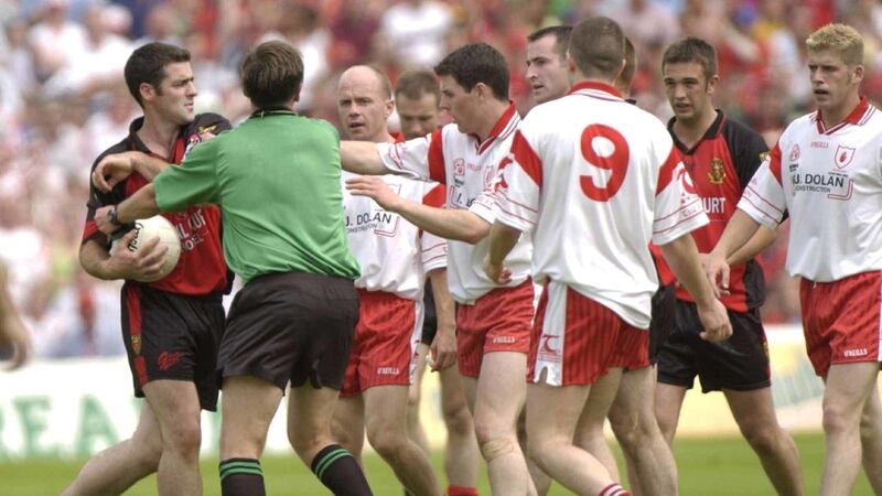 Gregory McCartan gets involved with Tyrone players after his red card in the 2003 Ulster final Picture by Sportsfile