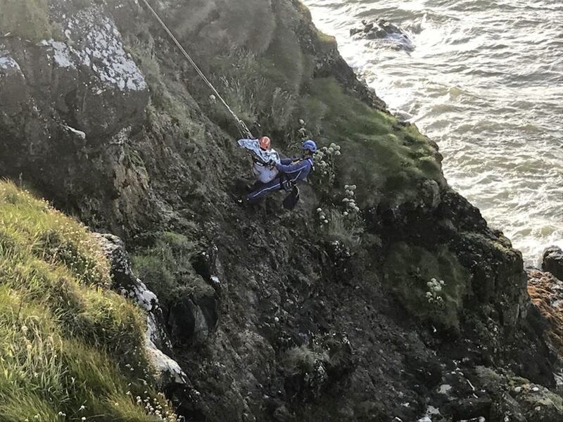 A coastguard `rope rescue technician&#39; descended the cliff and carried her to safety. Picture by Coleraine Coastguard 