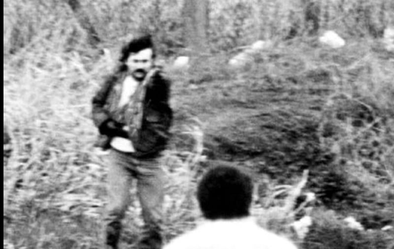 &nbsp;Michael Stone brandishing a pistol in Milltown Cemetery after a gun and grenade attack on mourners at a funeral of three IRA terrorists 1988