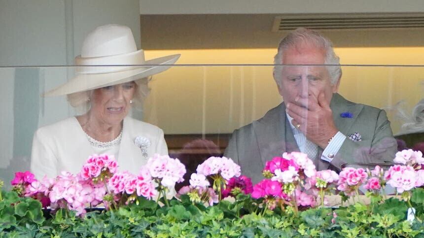 Camilla and Charles watch on as their horse Saga races in the Wolferton Stakes (Jonathan Brady/PA)