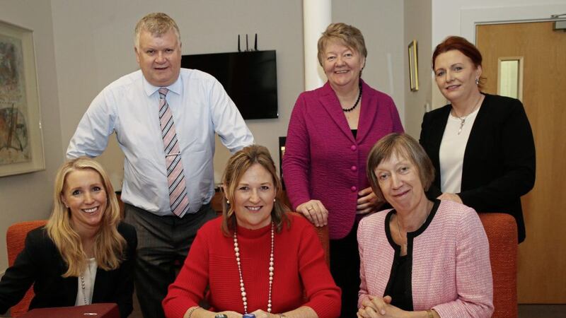 SITTING IN JUDGMENT: Women in Business and judging panel chair Roseann Kelly (seated centre) alongside Nicola McCleary, head of marketing at Danske Bank, and Evelyn Collins, chief executive of the NI Equality Commission. At back (from left) are Gary McDonald, business editor of the Irish News; Ellvena Graham, president of Northern Ireland Chamber of Commerce &amp; Trade and Avril Robson, owner and director of Corick House Hotel &amp; Spa. Photo: Hugh Russell 