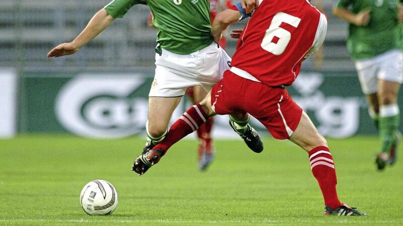 Switzerland&#39;s Johann Vogel takes the legs from Northern Ireland&#39;s Damien Johnson during a friendly in Zurich. Picture by Pacemaker 