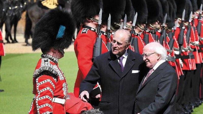 President Michael D Higgins (right) meets the Irish Guards mascot with British royal the Duke of Edinburgh at Windsor Castle last year. Picture by Peter Macdiarmid, Press Association 