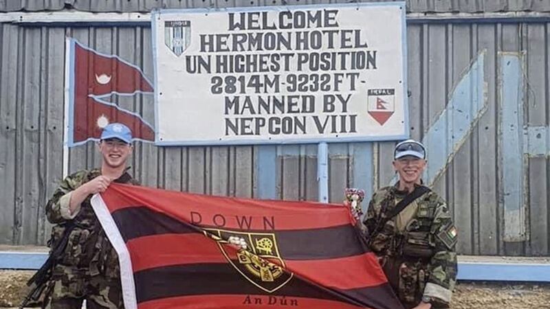 Flying the flag: Irish Army soldiers Tiarnan Burns (left) and Cathal Matthews display their county colours at the UN &lsquo;Hotel Hermon&rsquo; base in Syria 