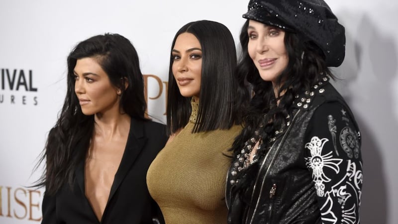 The singer joined Kim and Kourtney Kardashian at the US premiere of The Promise.