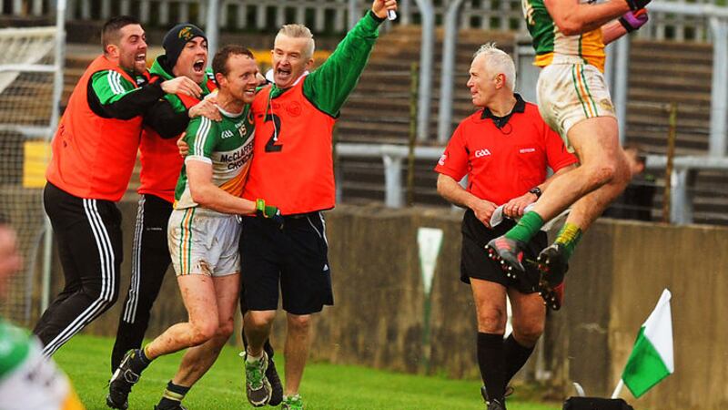 Michael Murphy punches the air after Glenswilly&rsquo;s Donegal SFC final win over Kilcar in Ballybofey yesterday, while (l-r) Kevin Cunningham, George Simmons, captain Gary McFadden, and assistant manager Gary McDaid enjoy the moment. Picture<br />by Michael O&rsquo;Donnell