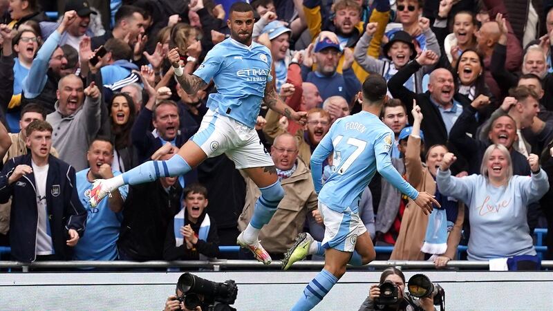 Manchester City’s Phil Foden (right) celebrates scoring their side’s first goal of the game with team-mate Kyle Walker during the Premier League match at the Etihad Stadium, Manchester. Picture date: Saturday September 23, 2023.