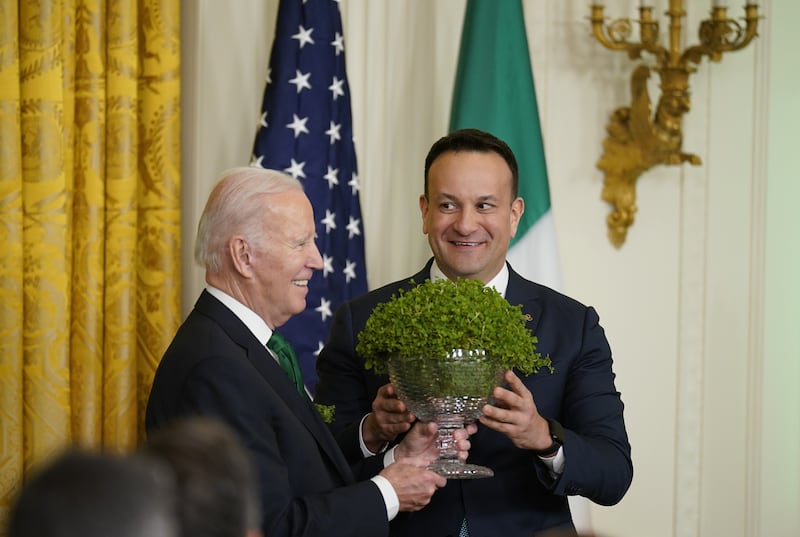 Taoiseach Leo Varadkar, right, presents US President Joe Biden with a bowl of Shamrock during a St Patrick’s Day Celebration reception in 2023