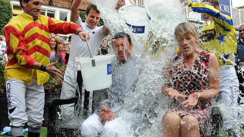 File photo of jockey Frankie Dettori and presenter Clare Balding taking part in the Ice Bucket Challenge at York Racecourse in 2014. Picture by Anna Gowthorpe, Press Association 