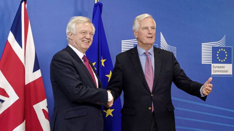 EU Chief Brexit Negotiator Michel Barnier (right) and British Brexit Secretary David Davis at EU headquarters in Brussels as negotiations began last month. Picture by Geert Vanden Wijngaert, Associated Press